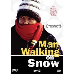 MAN WALKING ON SNOW